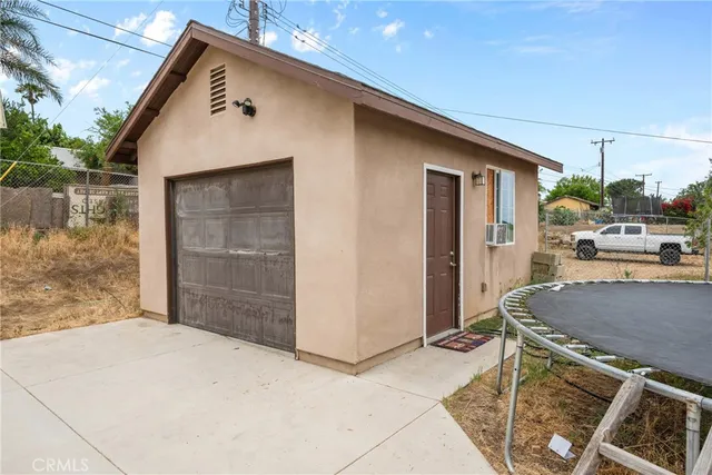 a balcony with table and chairs
