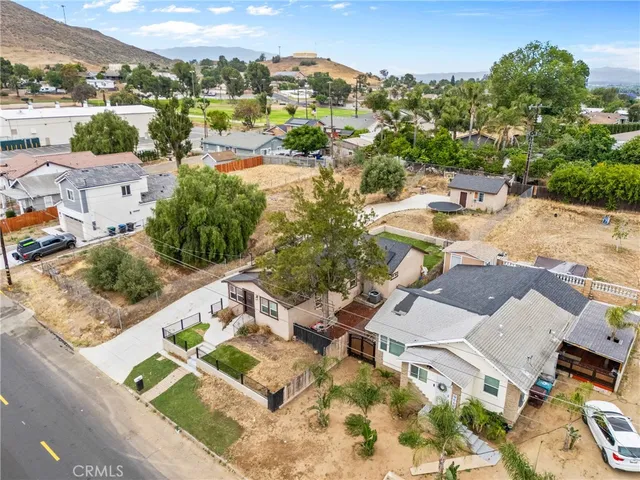 an aerial view of residential houses with outdoor space