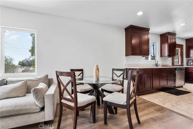 a view of a dining room with furniture and window