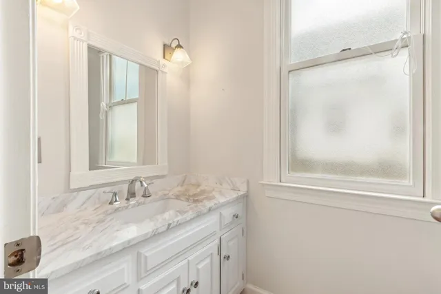 a spacious bedroom with a bed and window