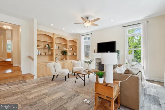a view of an empty room with wooden floor and closet