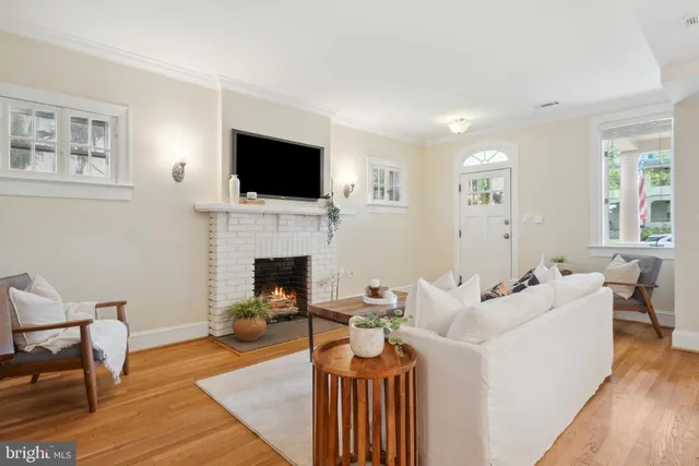 a dining room with furniture a chandelier and window