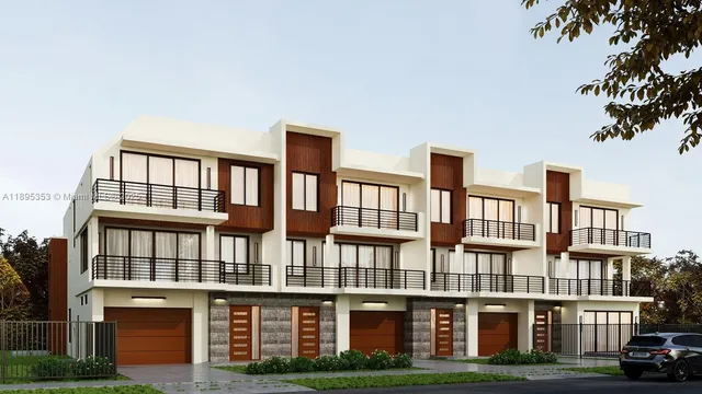 a front view of a residential apartment building with a yard