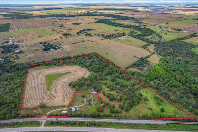 a view of a swimming pool with a yard