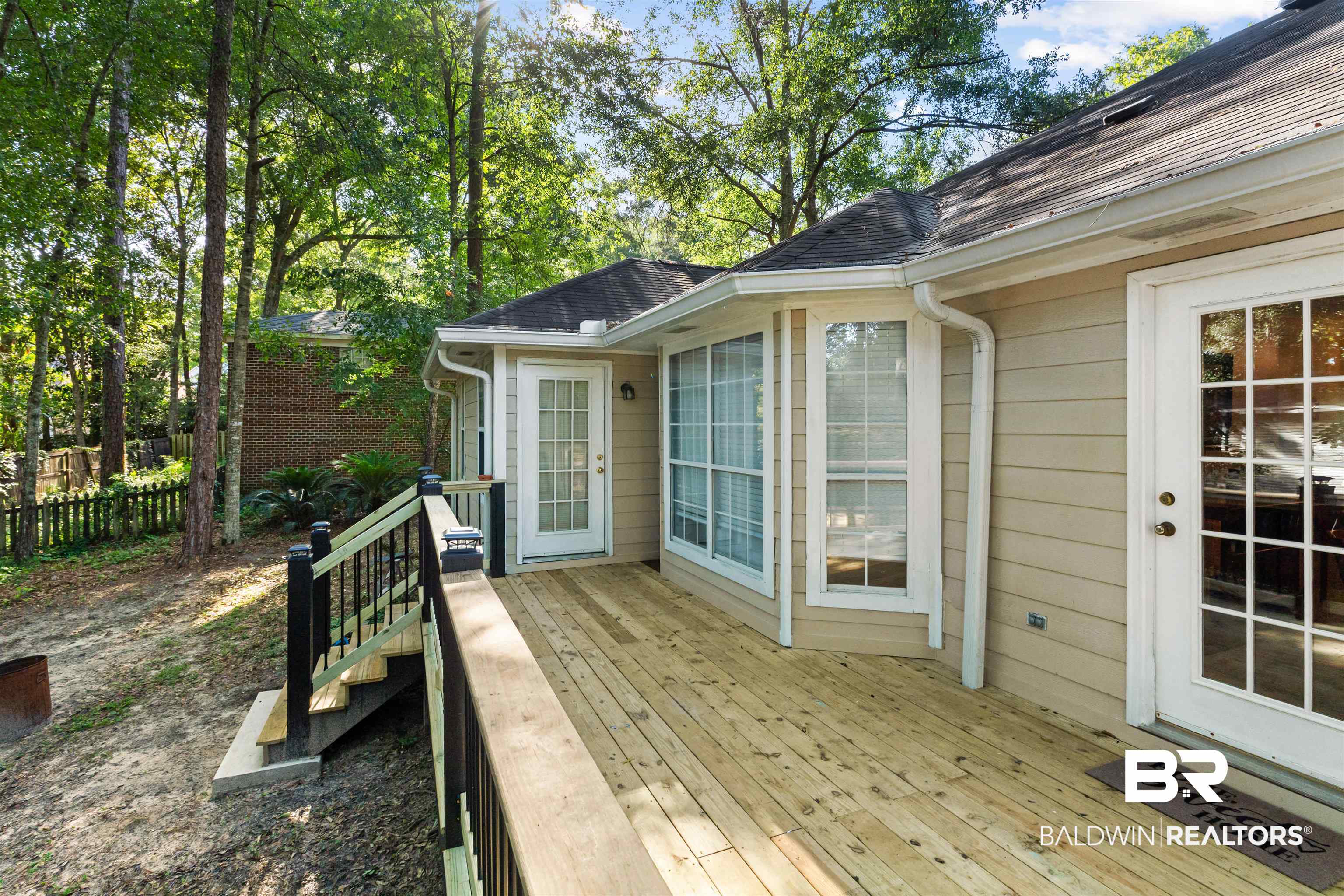 153 Lakeview Loop Daphne, AL 36526 - Photo 53 of 56 Multiple French doors provide convenient access and make indoor-outdoor living feel effortless.