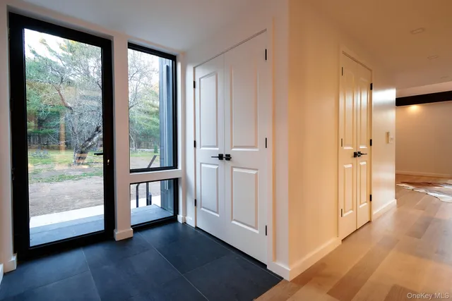 a view of entryway with wooden floor and garden