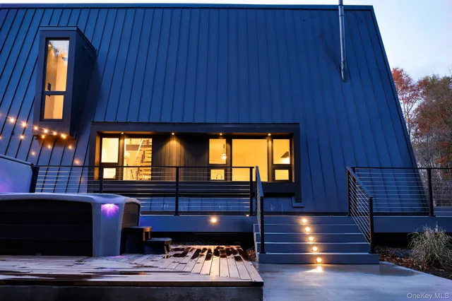 a room with wooden floors and windows
