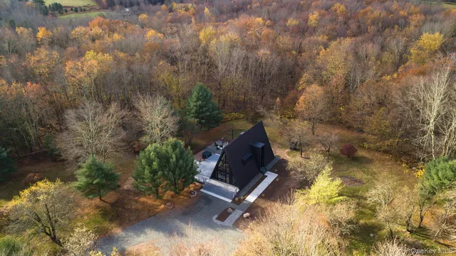 an aerial view of a house with outdoor space