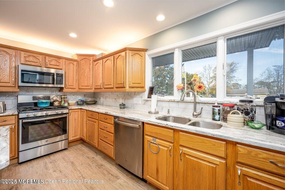 22 Queen Ann Road Brick, NJ 08723 - Photo 9 of 22 a kitchen with stainless steel appliances granite countertop a sink and cabinets