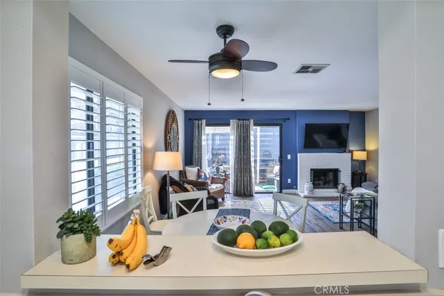 a kitchen with white cabinets and appliances