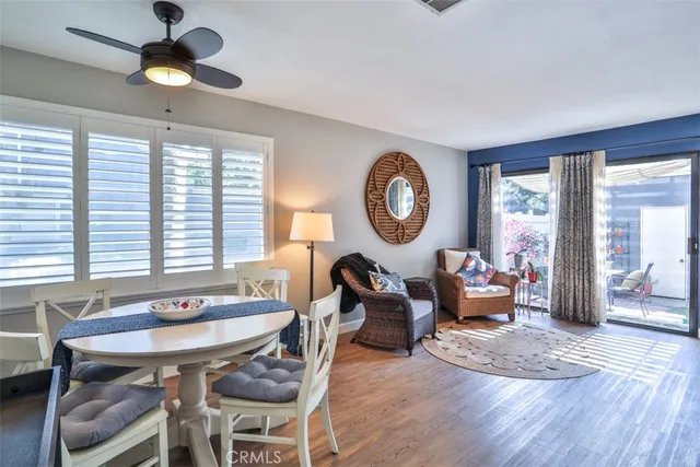 a view of a hallway with wooden floor windows and livingroom