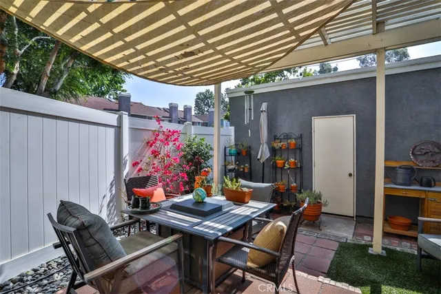 a view of a hallway with wooden floor and entryway