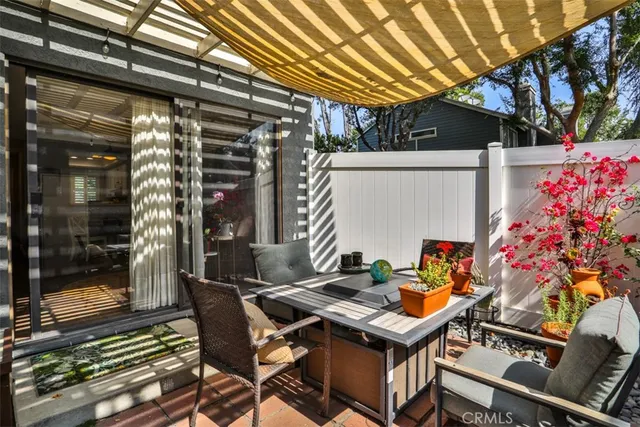 a patio with table and chairs