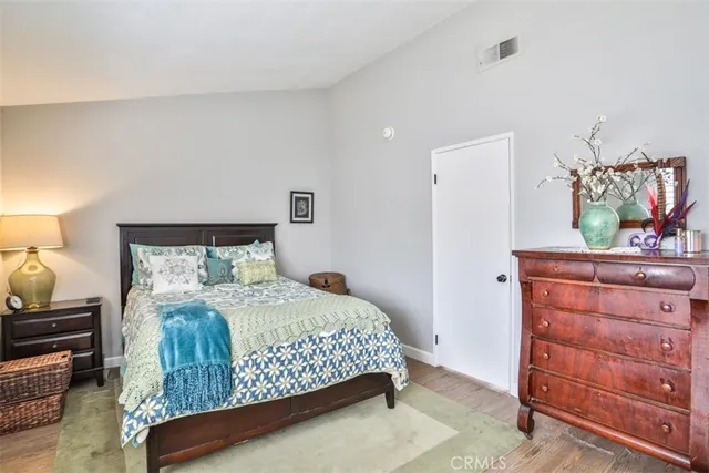 a bedroom with a bed and a dresser