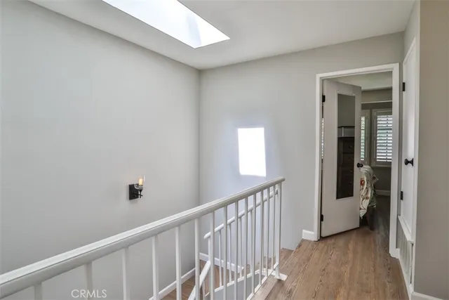 a view of a hallway with a window