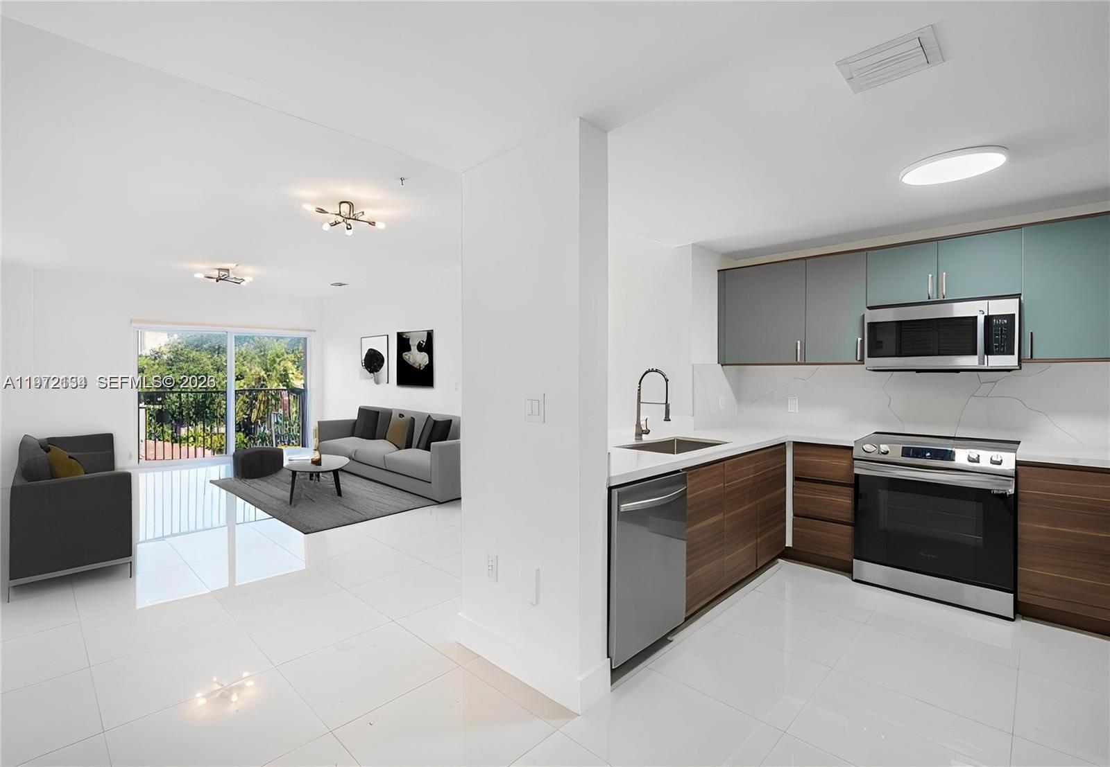 a kitchen with stainless steel appliances granite countertop a sink and stove top oven