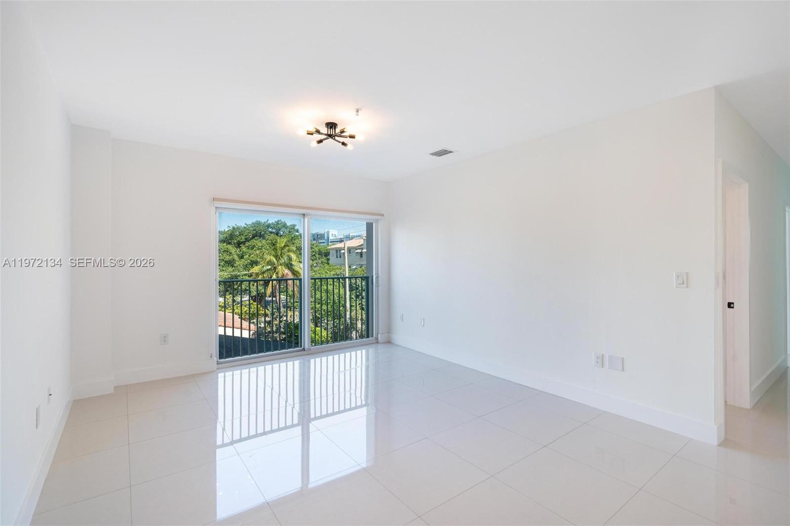 2280 Southwest 32nd Avenue, Unit 201 Miami, FL 33145 - Photo 12 of 23 an empty room with windows