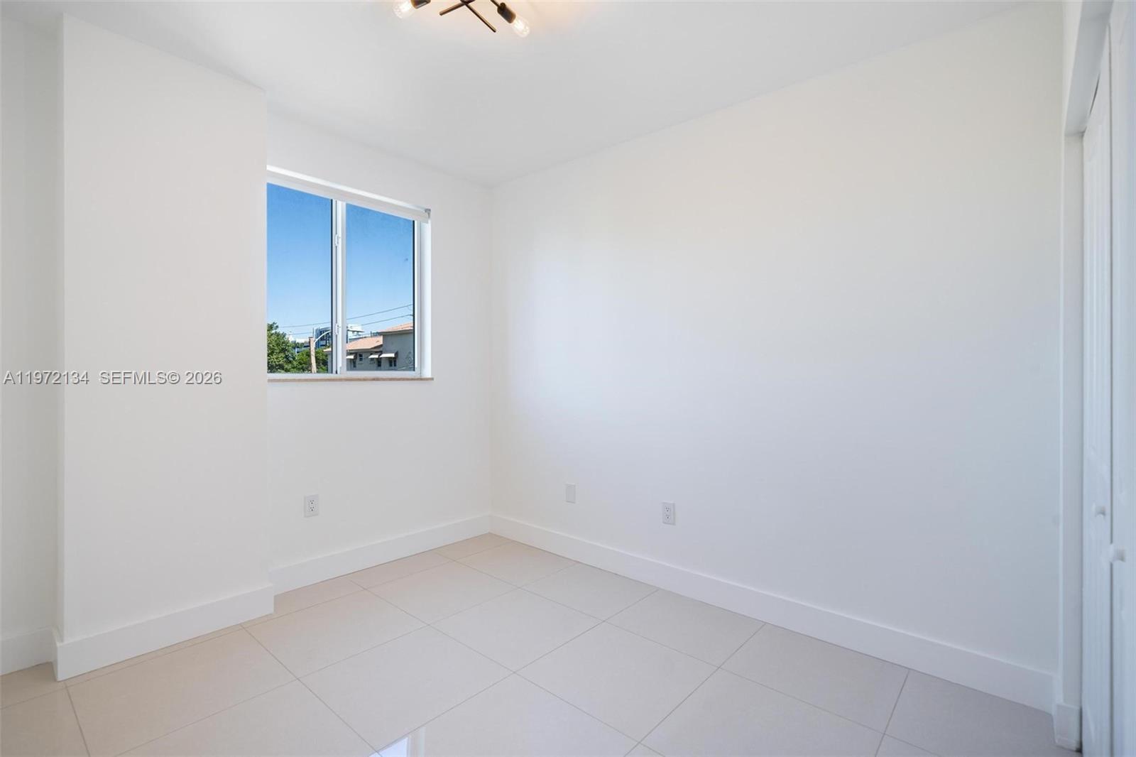 2280 Southwest 32nd Avenue, Unit 201 Miami, FL 33145 - Photo 13 of 23 a view of a small space with a window