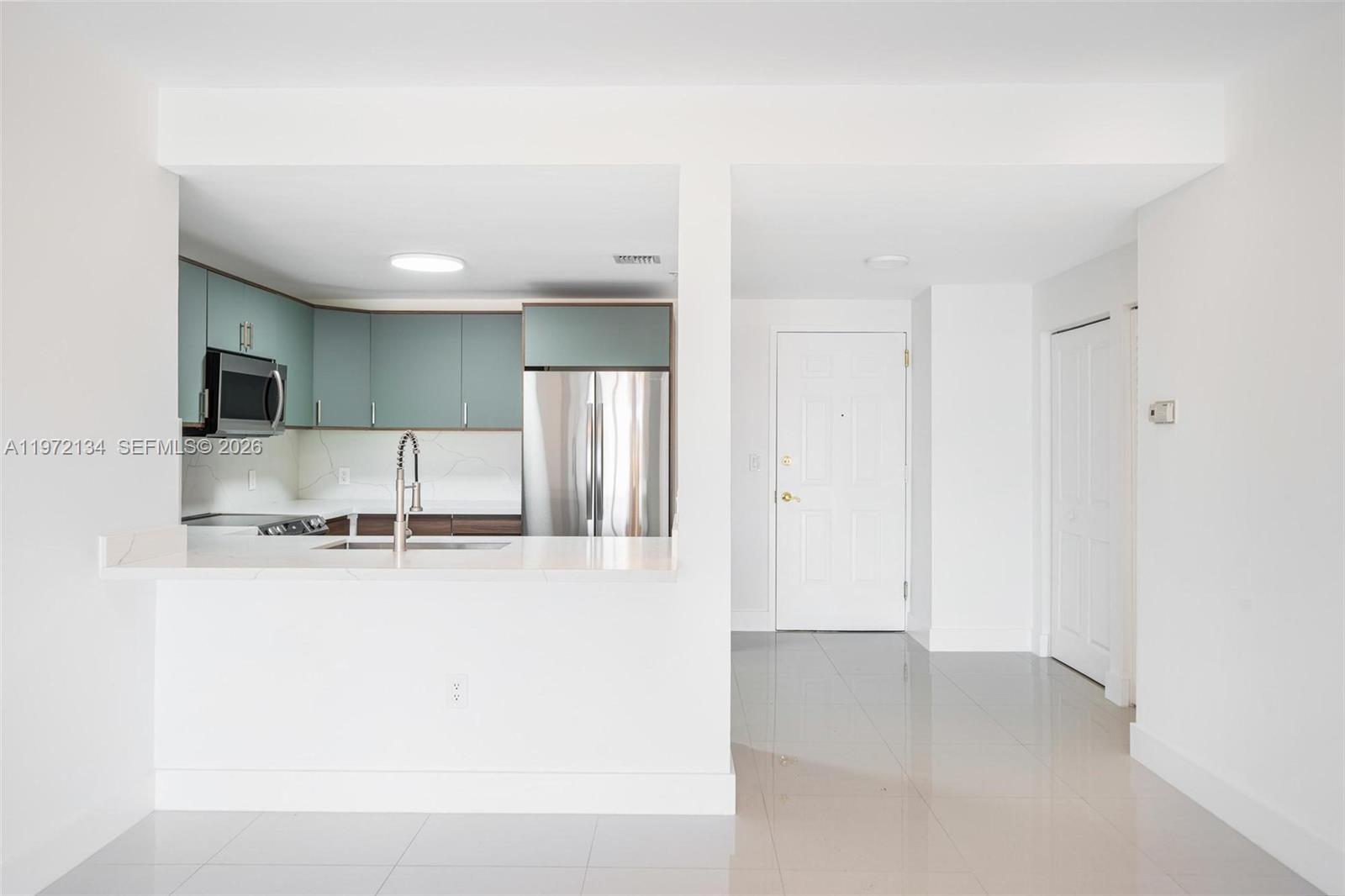 2280 Southwest 32nd Avenue, Unit 201 Miami, FL 33145 - Photo 14 of 23 a view of a kitchen with a sink