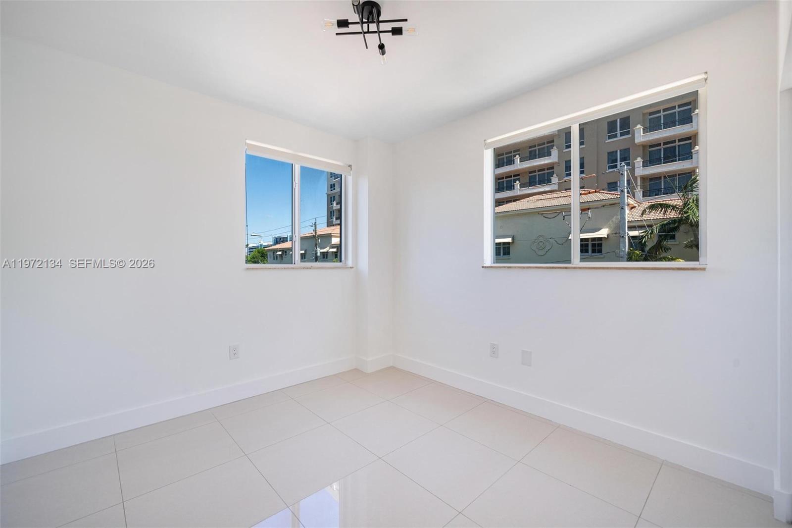 2280 Southwest 32nd Avenue, Unit 201 Miami, FL 33145 - Photo 20 of 23 a view of empty room with windows