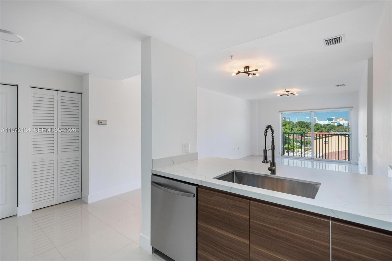 2280 Southwest 32nd Avenue, Unit 201 Miami, FL 33145 - Photo 3 of 23 a kitchen with a sink and a window
