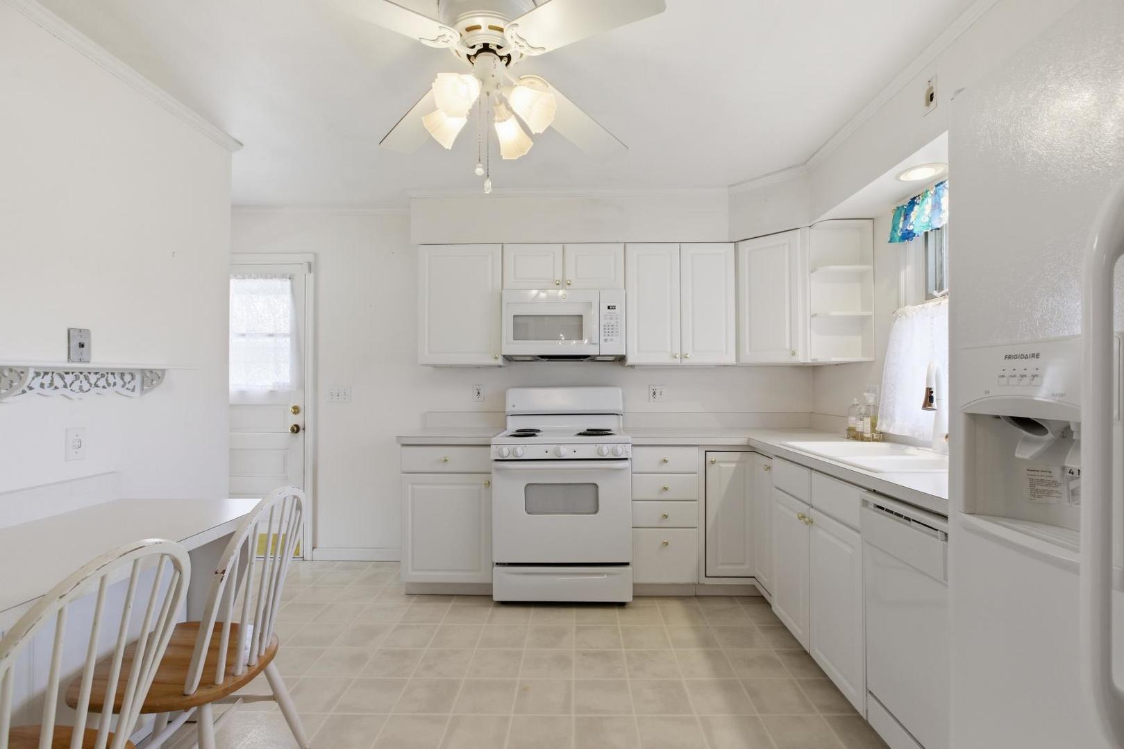 700 Ford Avenue Elgin, IL 60120 - Photo 6 of 20 a kitchen with stainless steel appliances a sink stove and cabinets