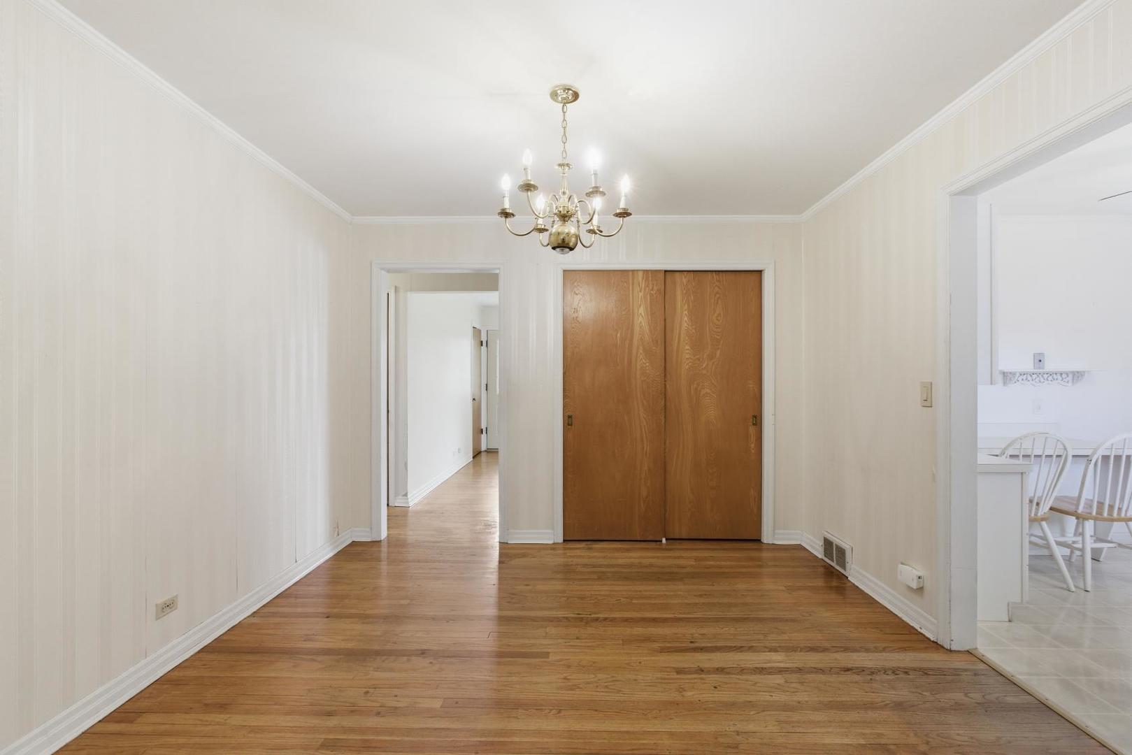 700 Ford Avenue Elgin, IL 60120 - Photo 8 of 20 a view of an empty room with wooden floor