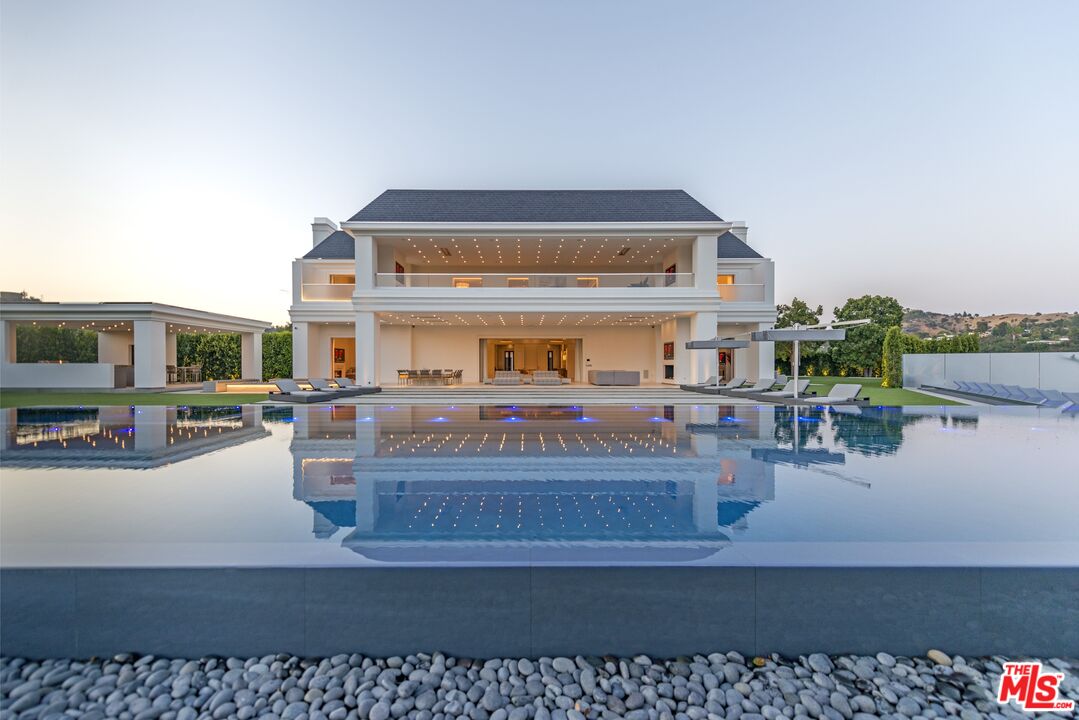 2571 Wallingford Drive Beverly Hills, CA 90210 - Photo 15 of 23 a living room with furniture and a table