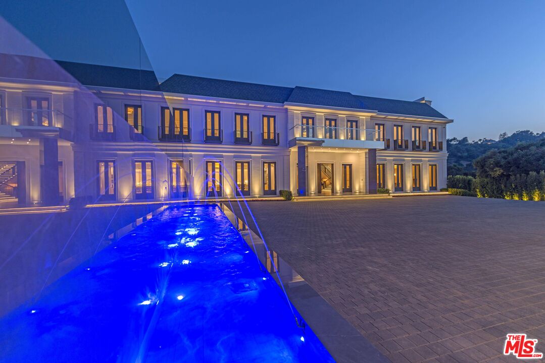 2571 Wallingford Drive Beverly Hills, CA 90210 - Photo 3 of 23 a front view of residential houses with yard