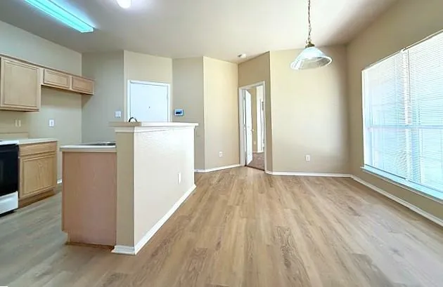 an empty room with windows and closet