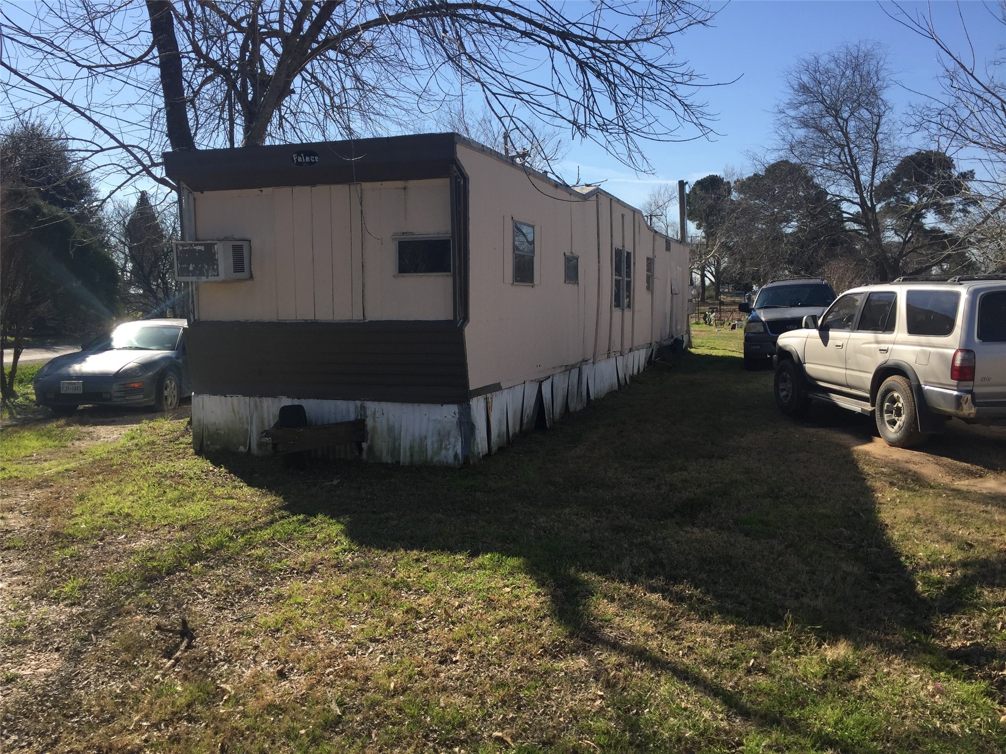 701 Alice Street El Campo, TX 77437 - Photo 3 of 6 a view of a back yard of the house
