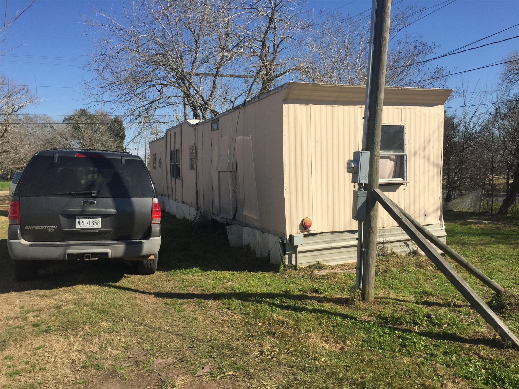 701 Alice Street El Campo, TX 77437 - Photo 4 of 6 a house view with a backyard space