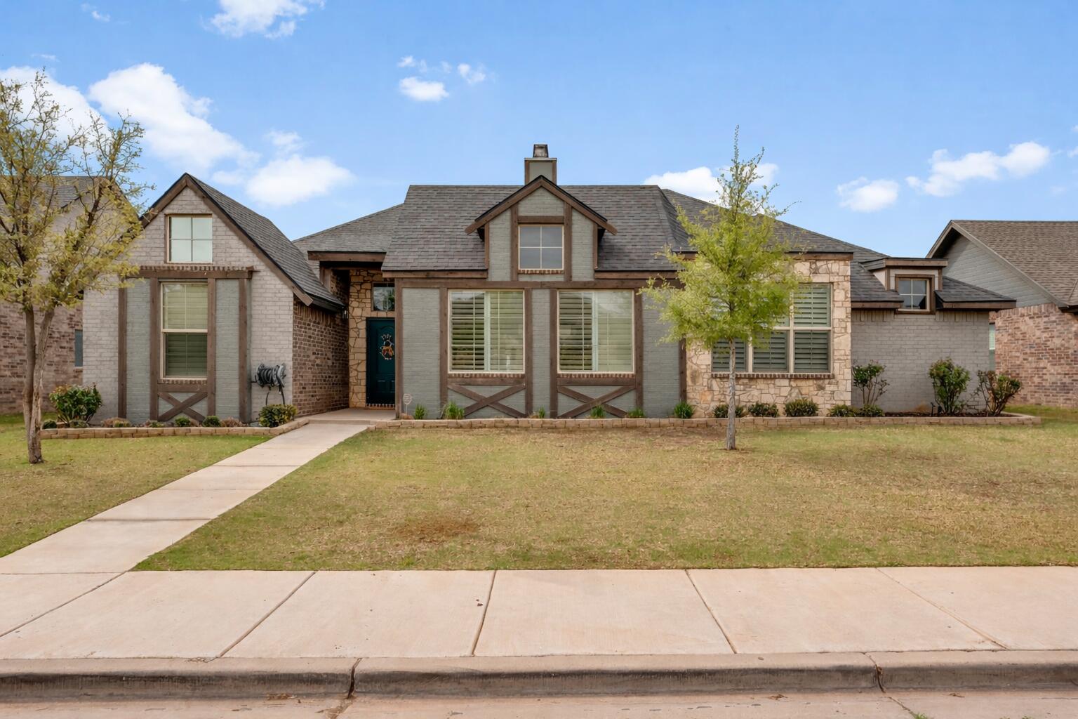 3611 133rd Street Lubbock, TX 79423 - Photo 1 of 31 a front view of a house with a yard