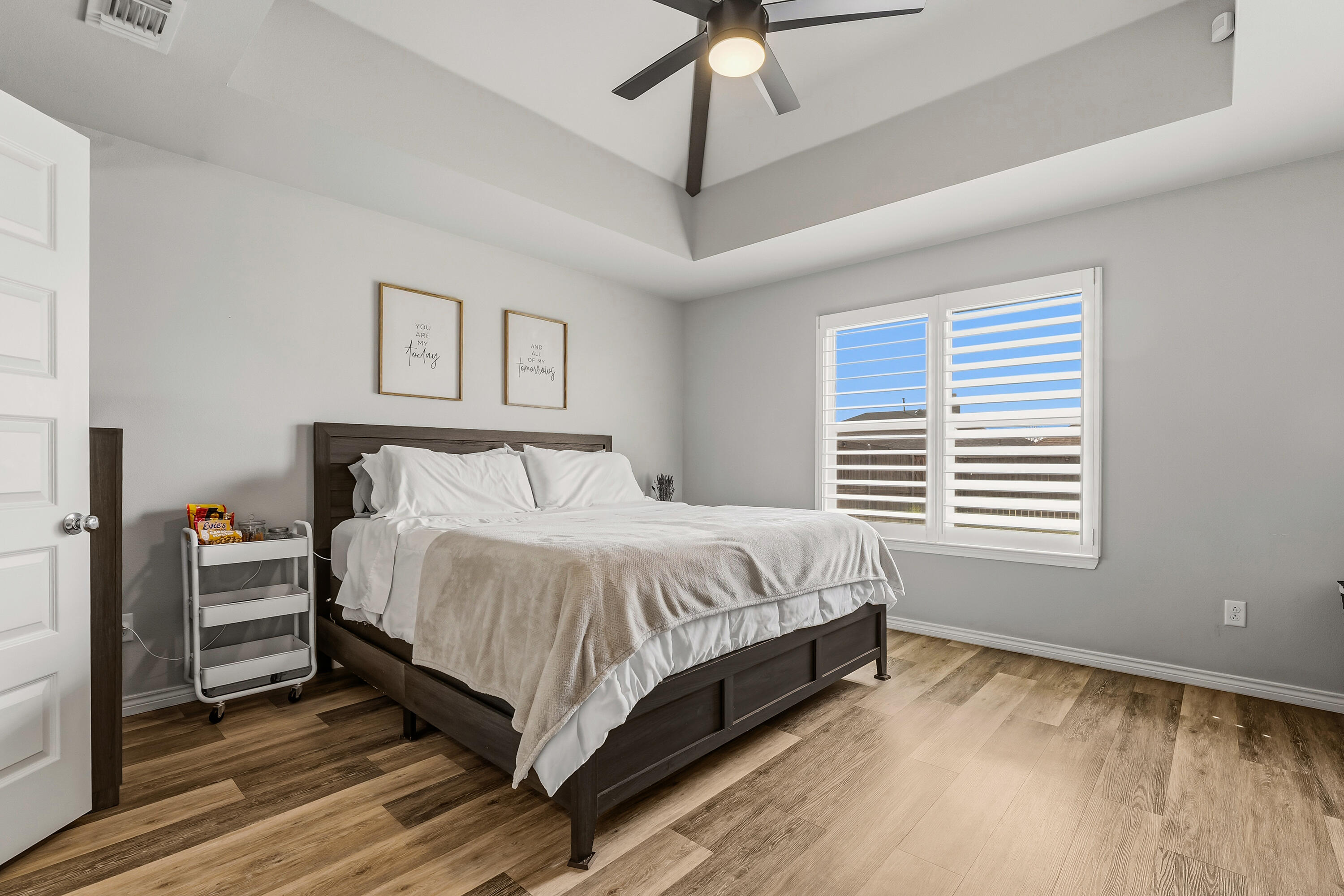 3611 133rd Street Lubbock, TX 79423 - Photo 18 of 31 a spacious bedroom with a bed and a window