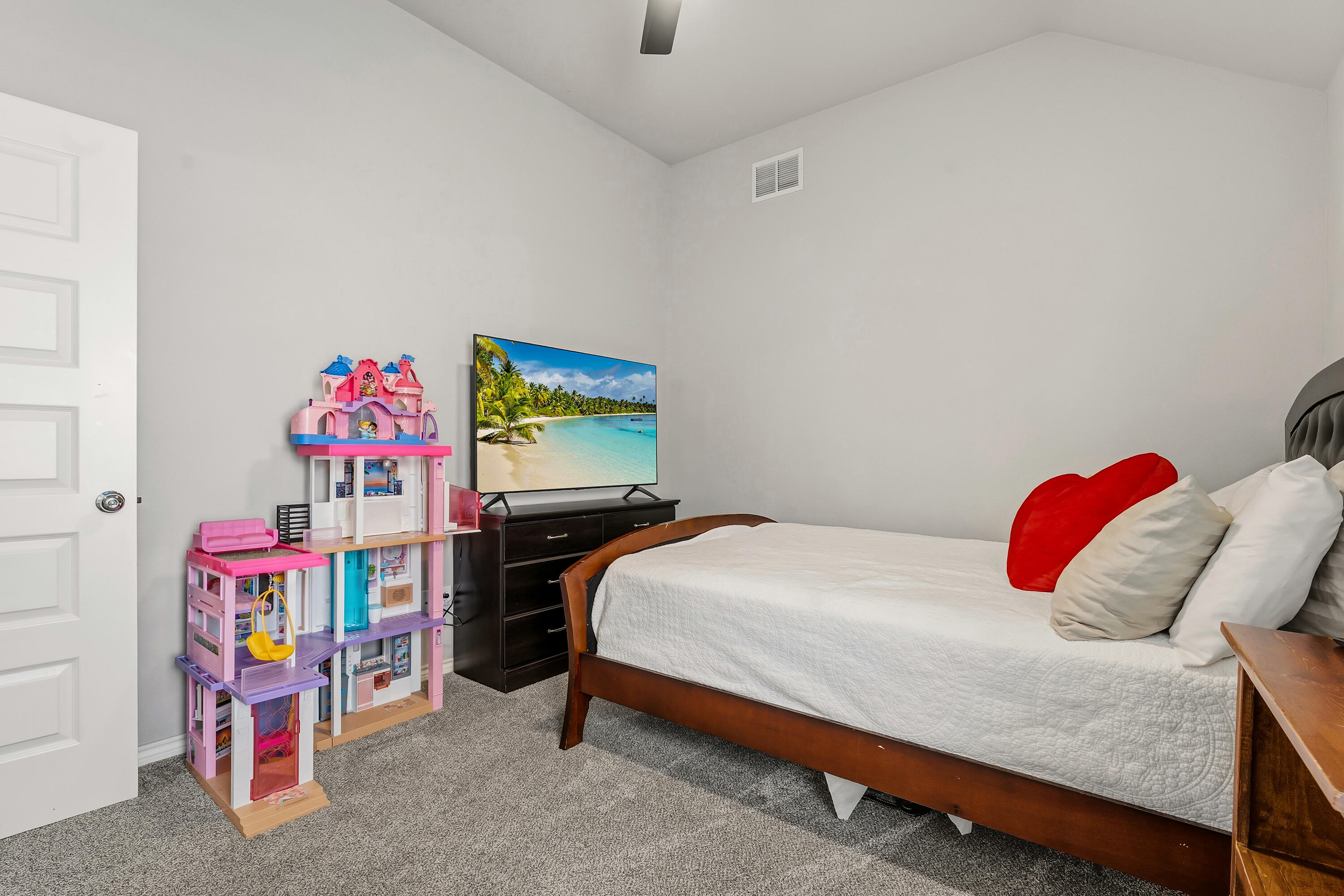 3611 133rd Street Lubbock, TX 79423 - Photo 24 of 31 a bedroom with a bed and a dresser