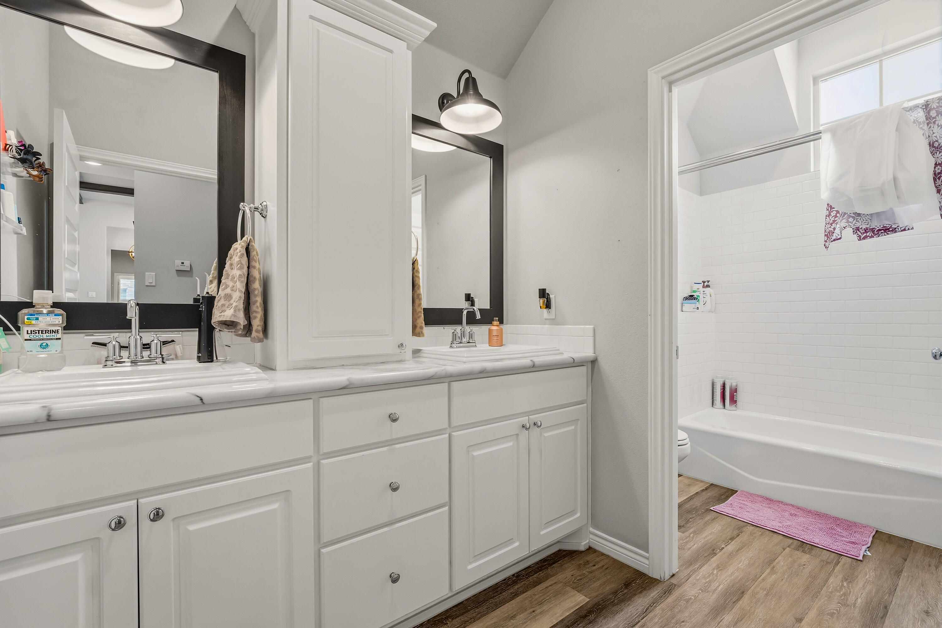 3611 133rd Street Lubbock, TX 79423 - Photo 25 of 31 a bathroom with a sink and a mirror