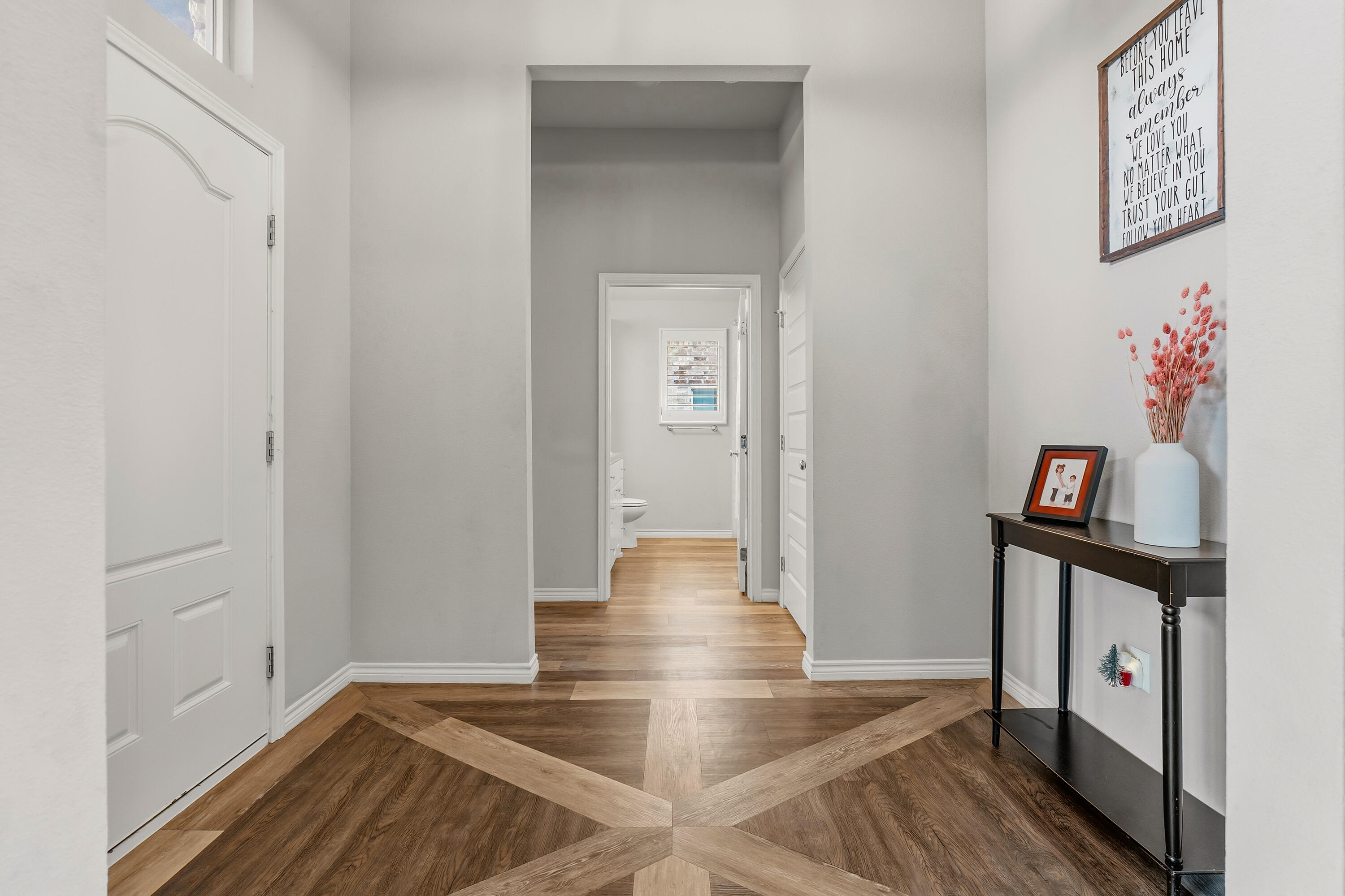 3611 133rd Street Lubbock, TX 79423 - Photo 4 of 31 a view of a hallway with wooden floor and workspace