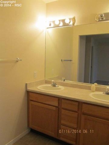 8059 Oliver Road Peyton, CO 80831 - Photo 7 of 9 Master bath with double vanities