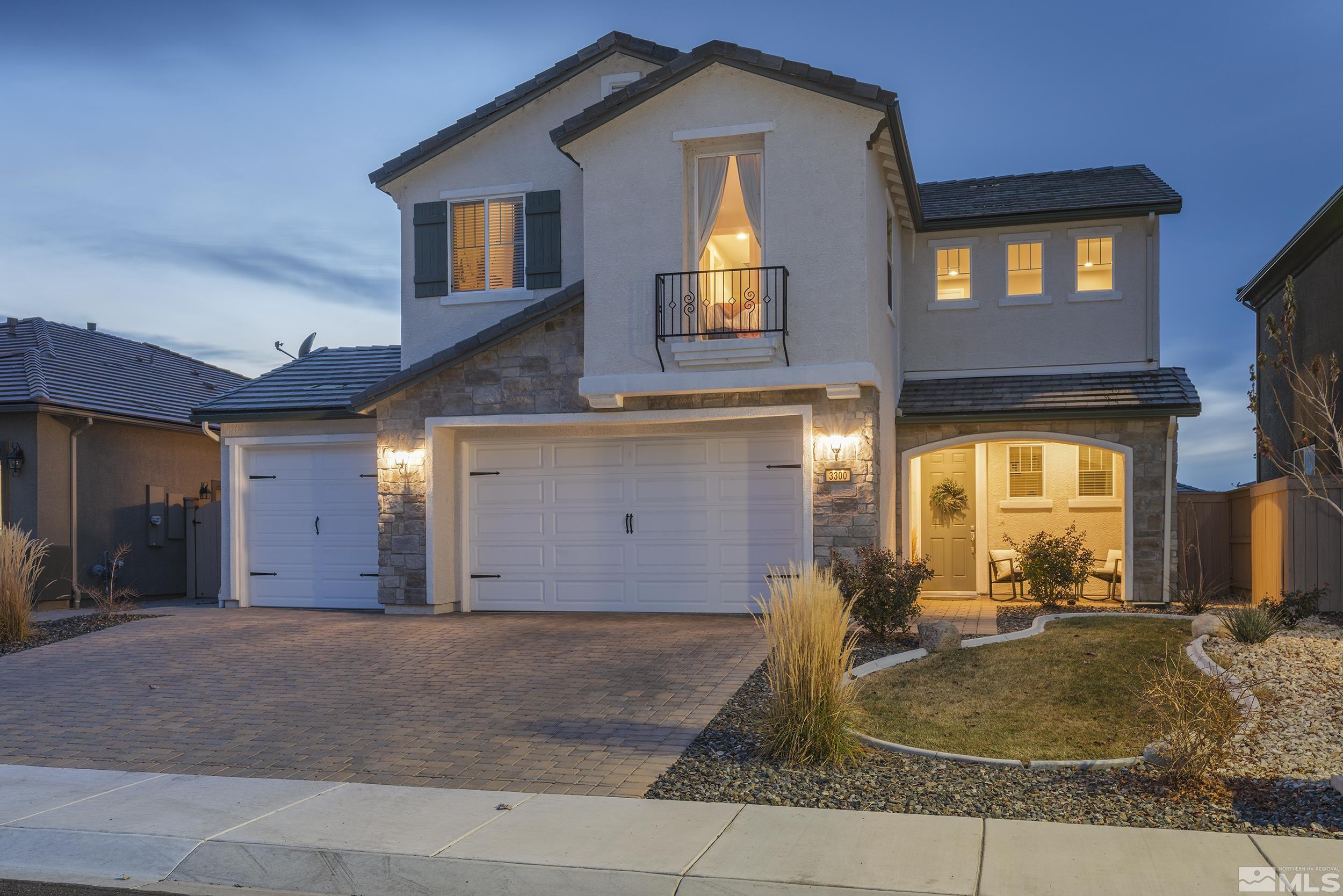 3300 Show Jumper Lane Reno, NV 89521 - Photo 1 of 40 a view of a house with a garage