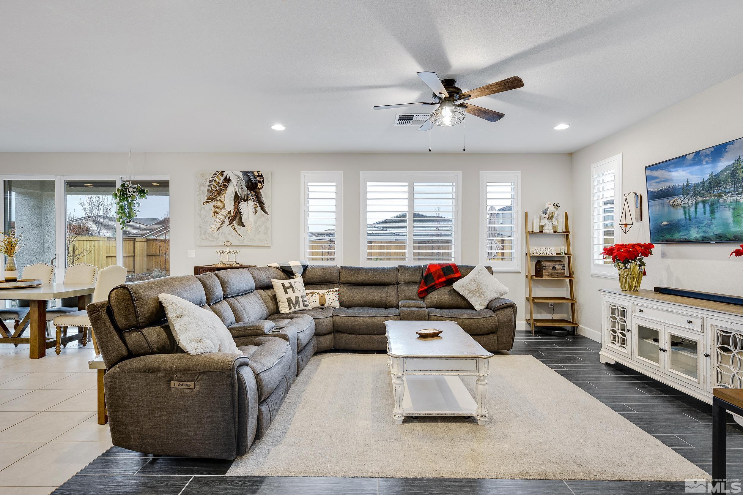 3300 Show Jumper Lane Reno, NV 89521 - Photo 11 of 40 a living room with furniture fireplace and flat screen tv
