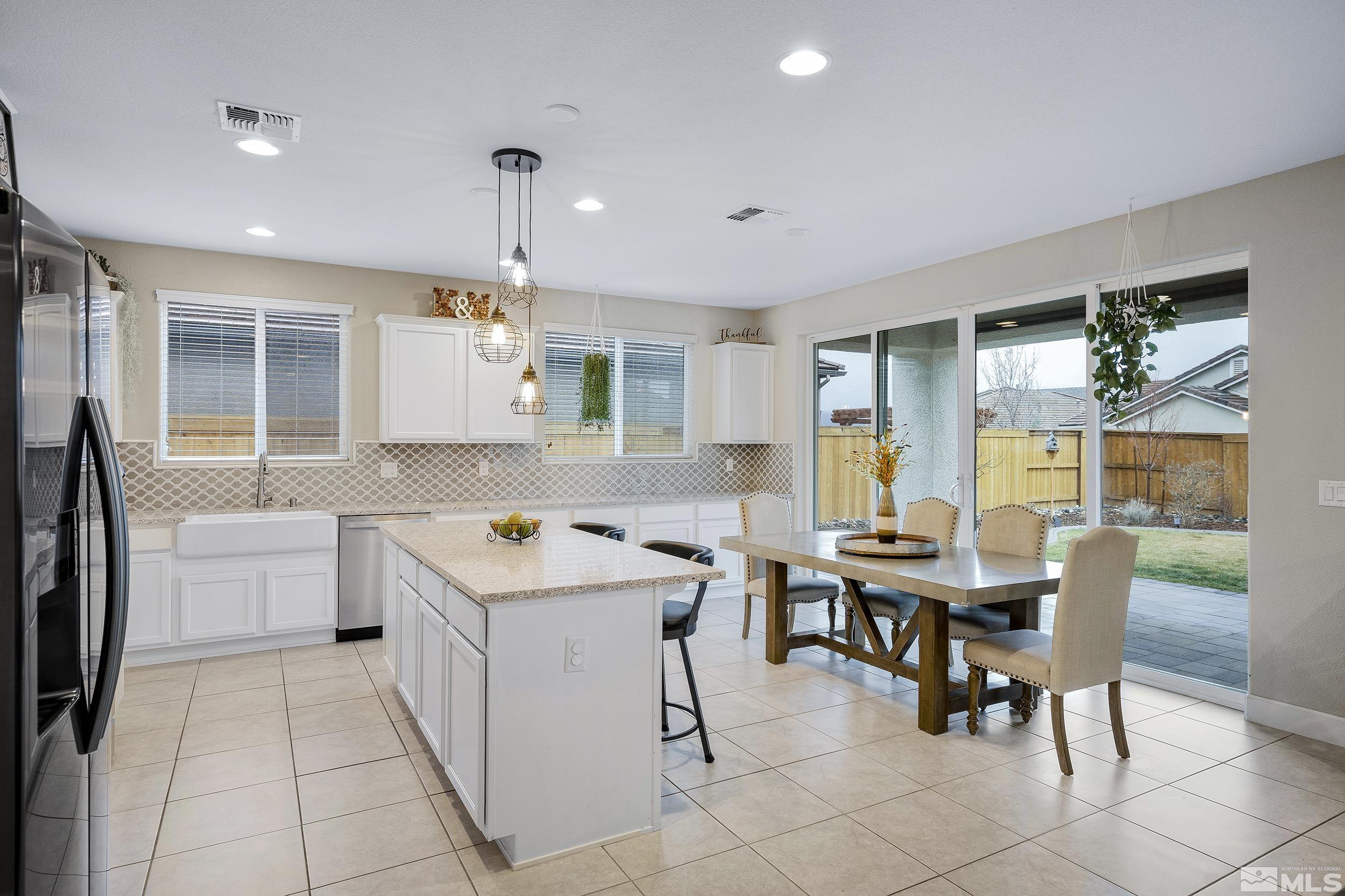 3300 Show Jumper Lane Reno, NV 89521 - Photo 13 of 40 a view of a dining room with furniture window and outside view