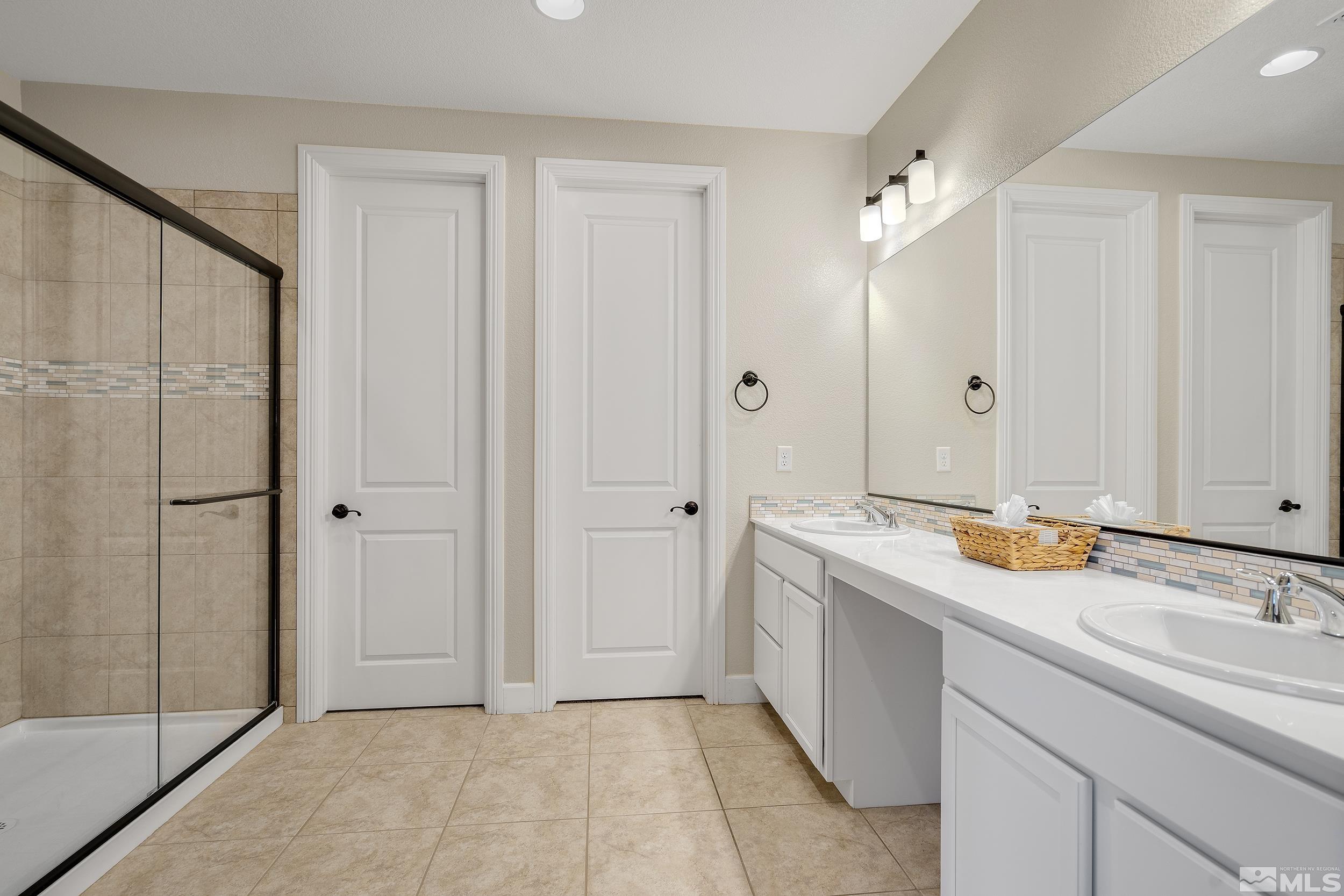 3300 Show Jumper Lane Reno, NV 89521 - Photo 18 of 40 a bathroom with a sink and mirror