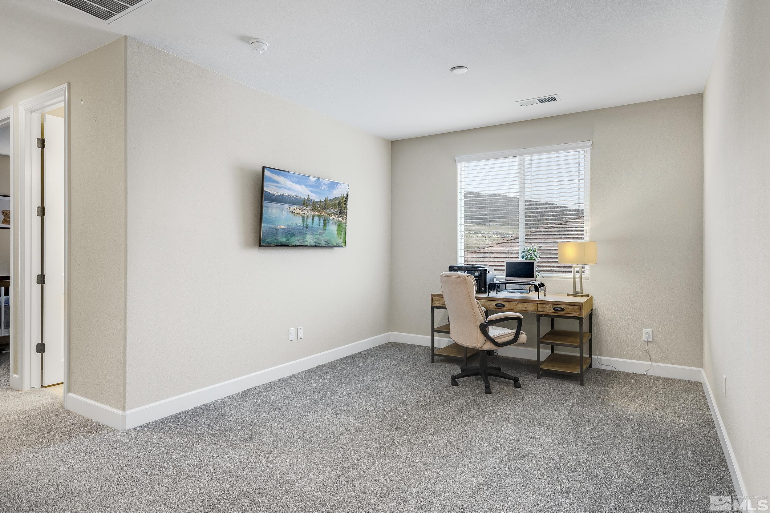 3300 Show Jumper Lane Reno, NV 89521 - Photo 22 of 40 a view of workspace with furniture and window