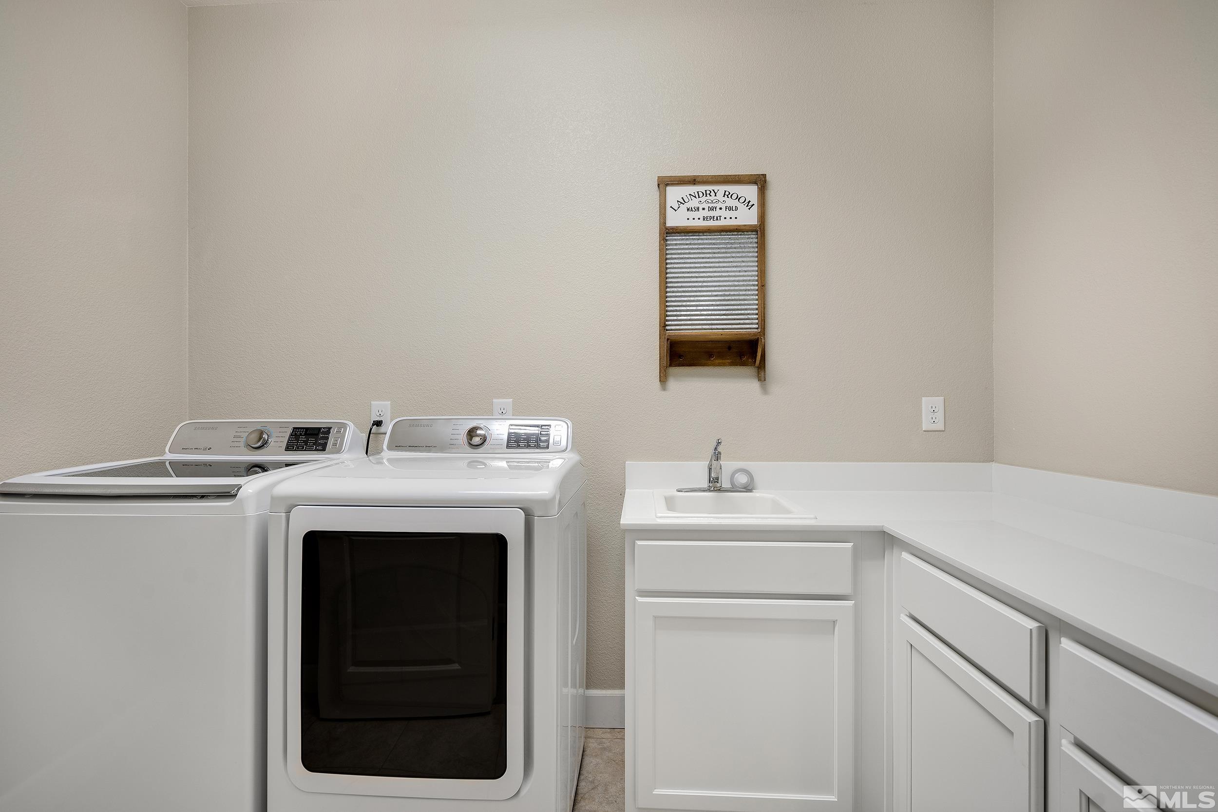 3300 Show Jumper Lane Reno, NV 89521 - Photo 23 of 40 a utility room with dryer and washer