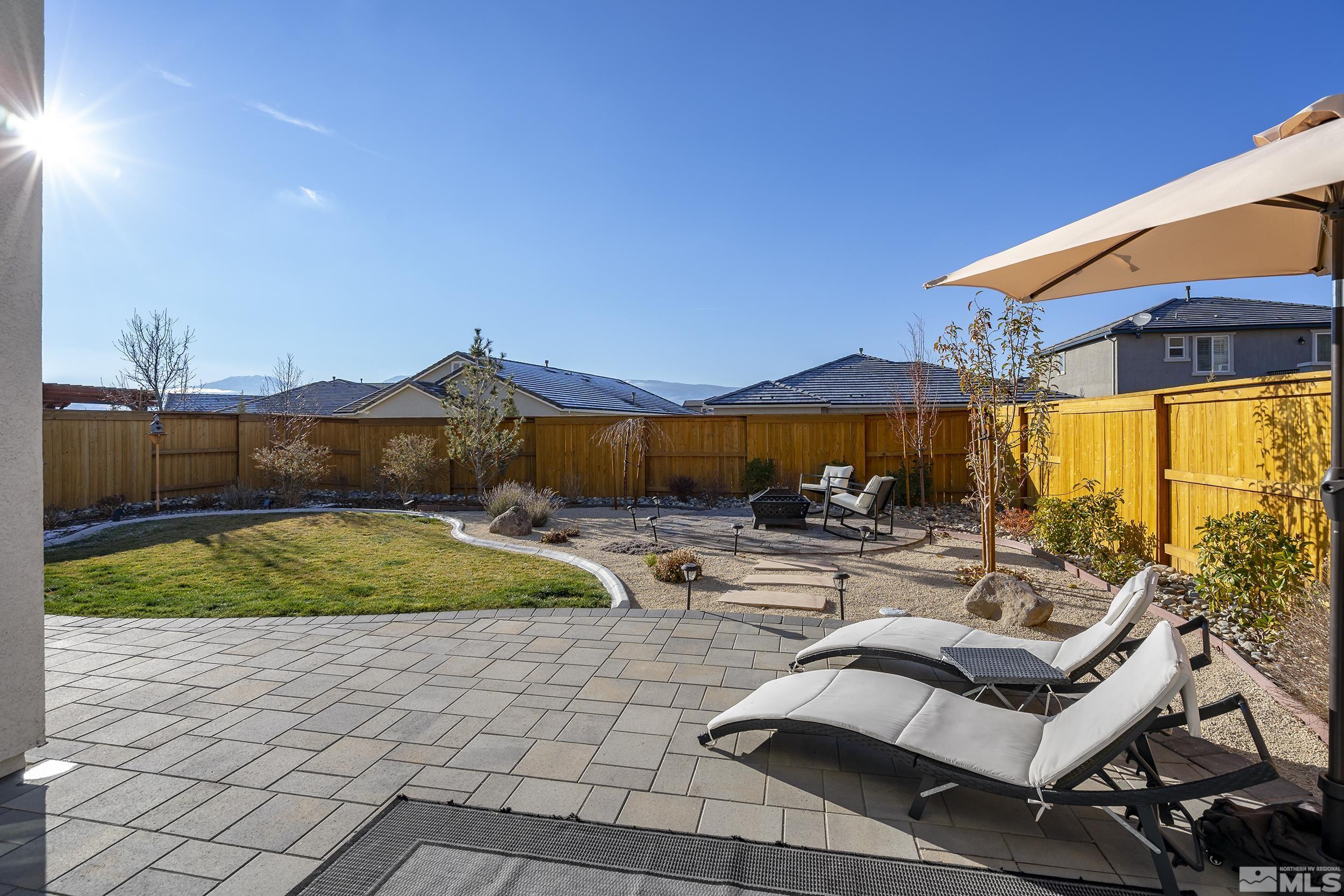 3300 Show Jumper Lane Reno, NV 89521 - Photo 30 of 40 a view of swimming pool with outdoor seating and a garden
