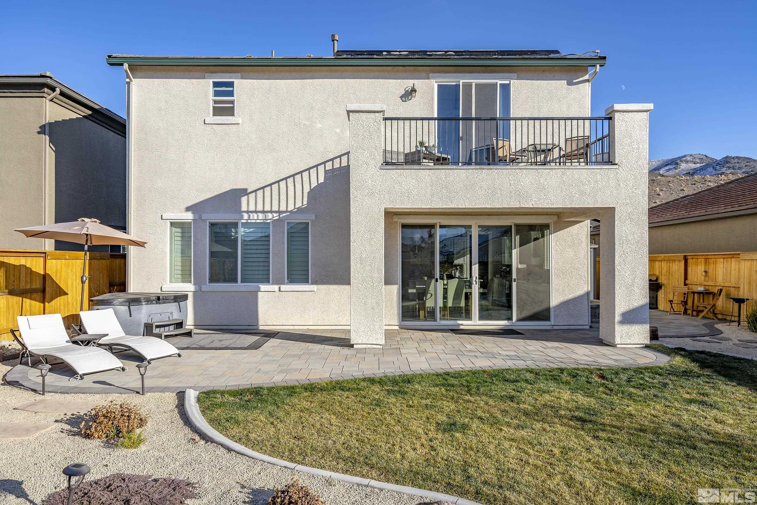 3300 Show Jumper Lane Reno, NV 89521 - Photo 32 of 40 a view of a house with backyard porch and sitting area