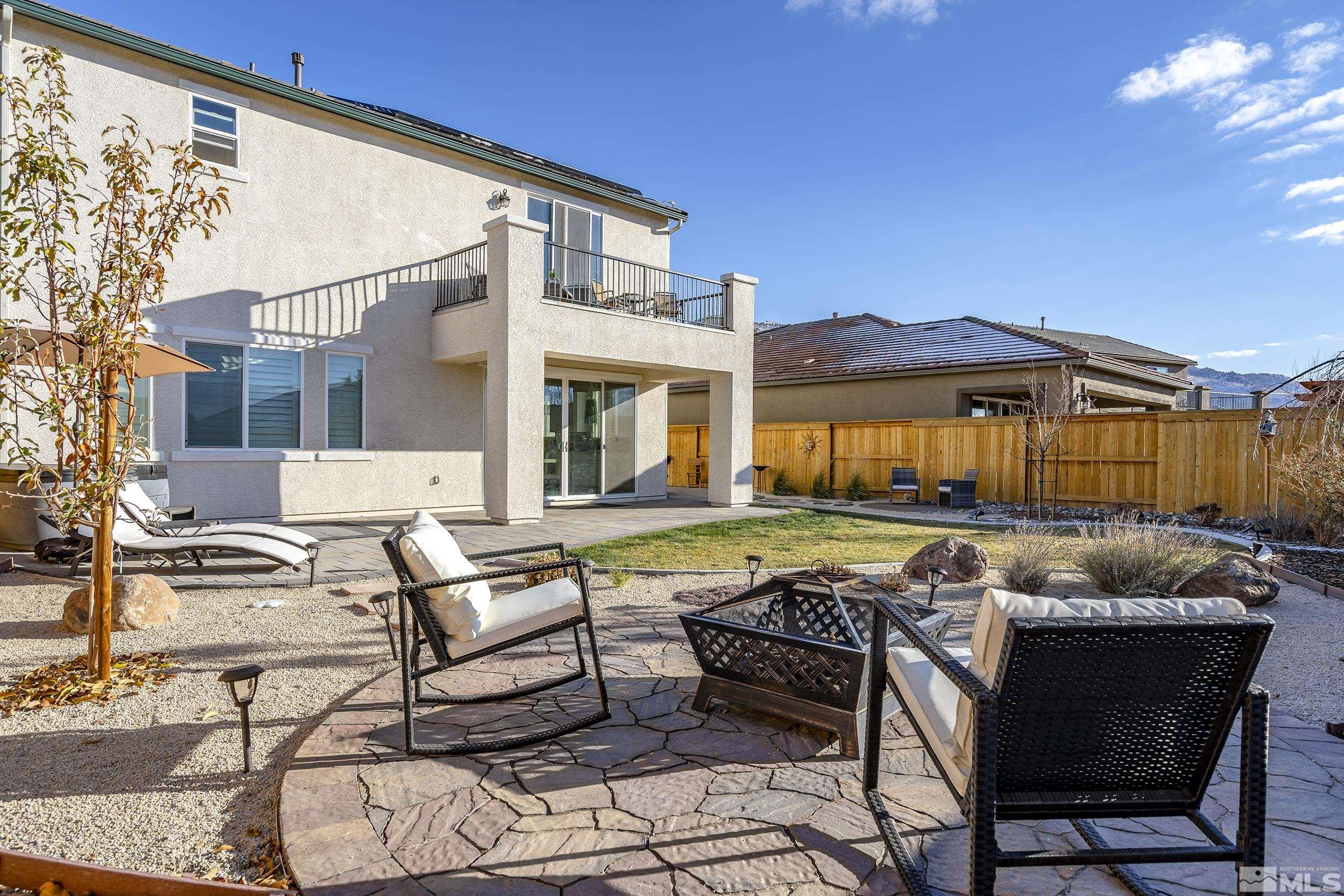 3300 Show Jumper Lane Reno, NV 89521 - Photo 35 of 40 a backyard of a house with table and chairs