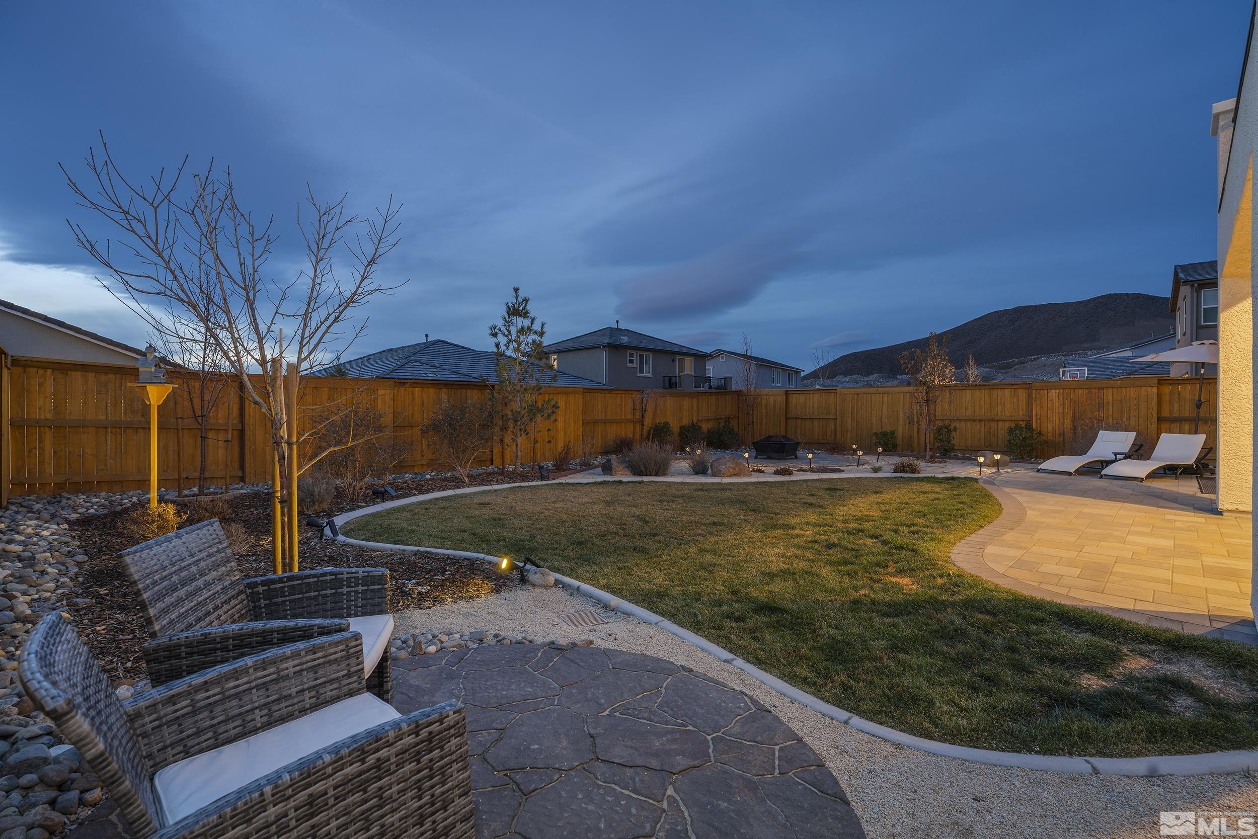 3300 Show Jumper Lane Reno, NV 89521 - Photo 4 of 40 a view of a backyard with wooden fence