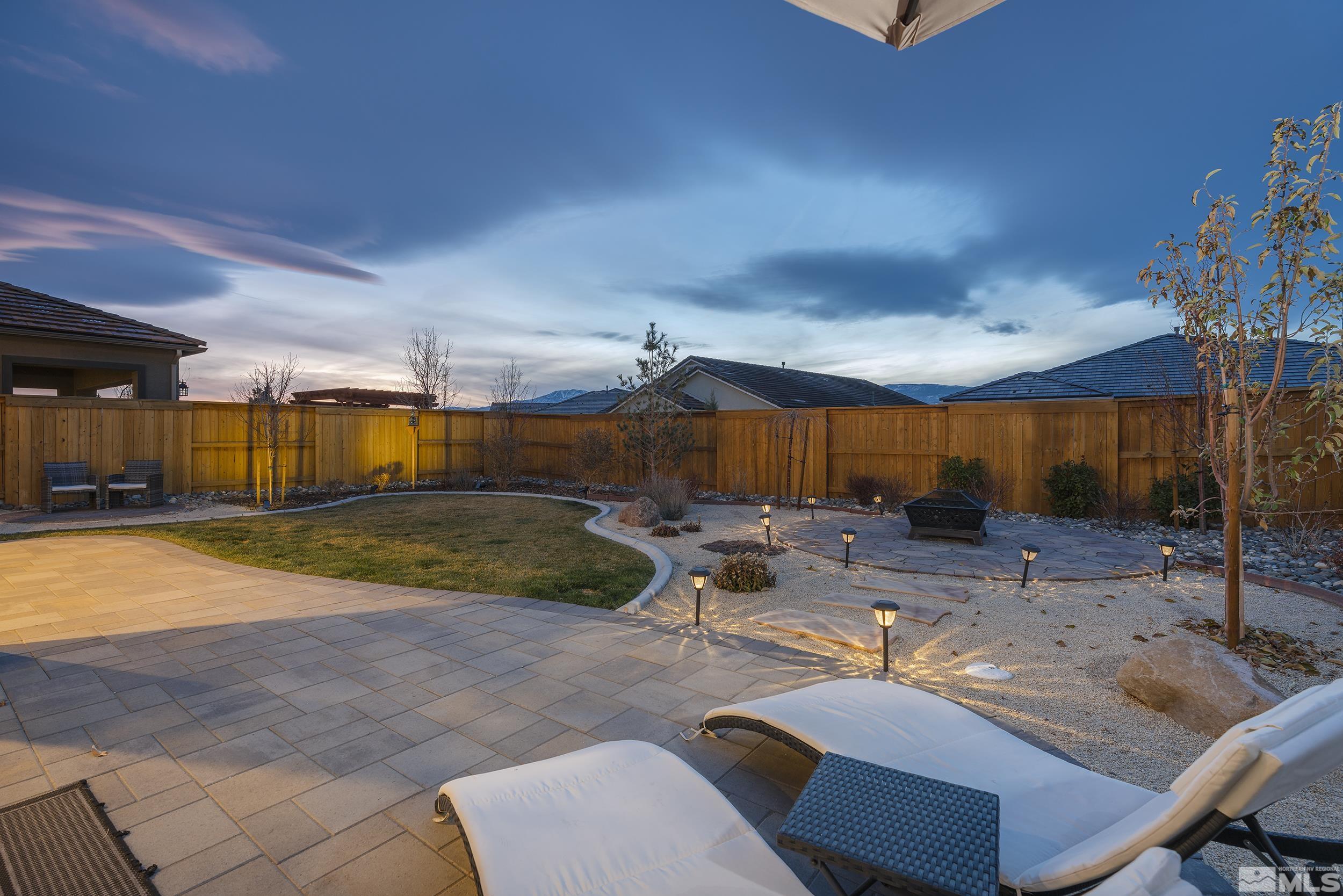 3300 Show Jumper Lane Reno, NV 89521 - Photo 5 of 40 a view of a patio with table and chairs with wooden fence