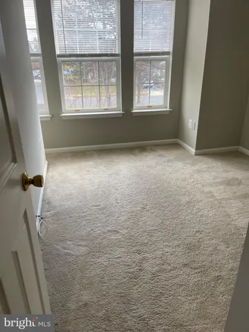 a bathroom with a toilet and washing machine